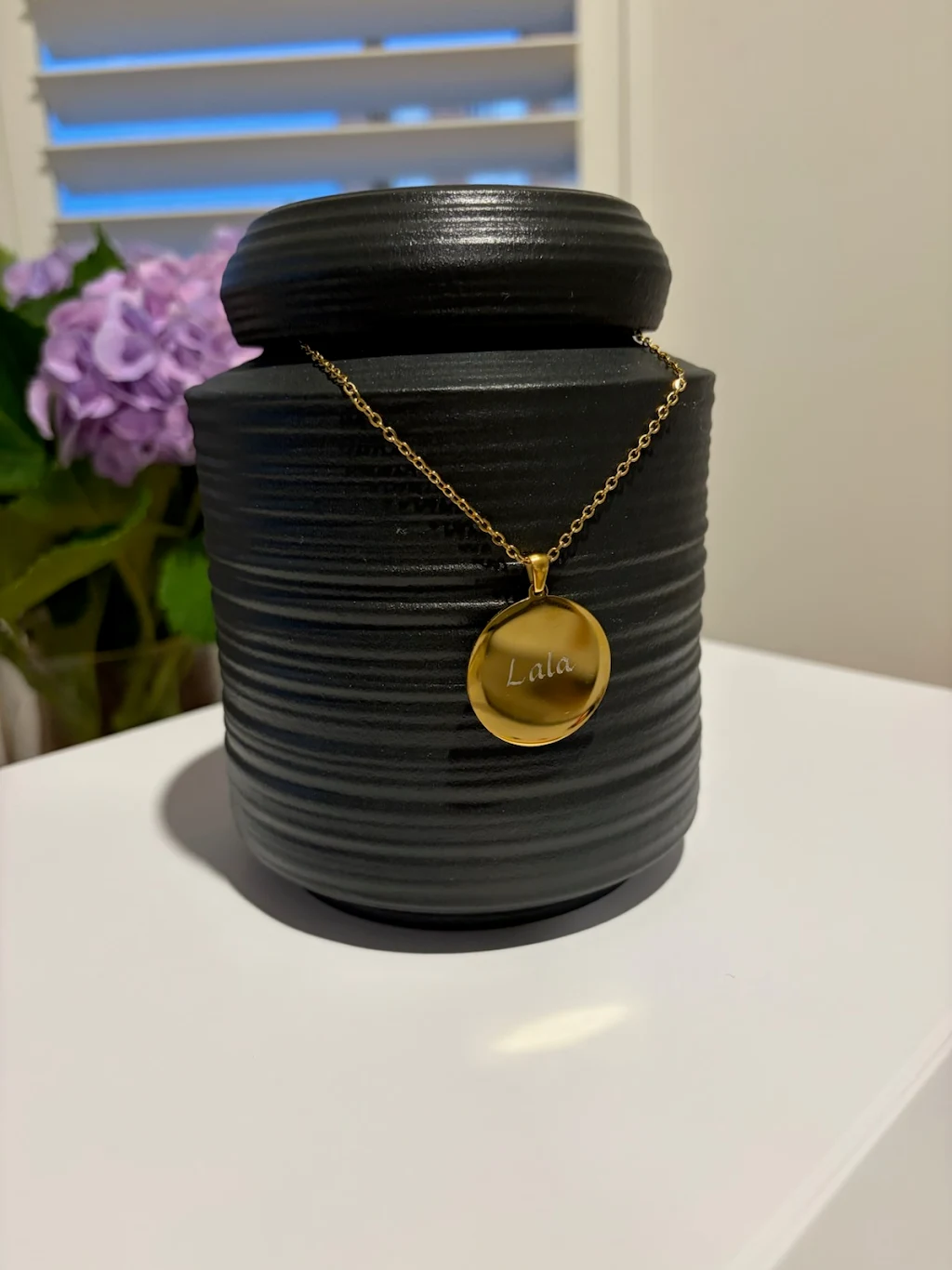 Lala's memorial urn with engraved pendant